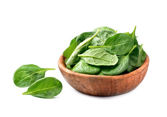 Fresh spinach salad in wooden plate