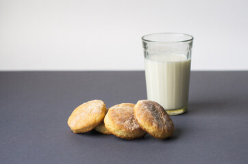 Milk and cookie. homemade shortcake and a glass of milk on the table on a white background