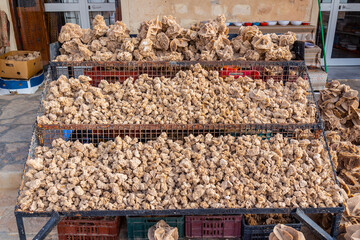 Sale of aharan gypsum desert rose in bazaar at Tunisia