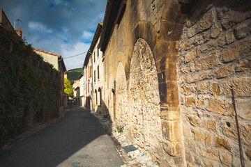 Ancient wall along the street in Alet-les-Bains, a village in France