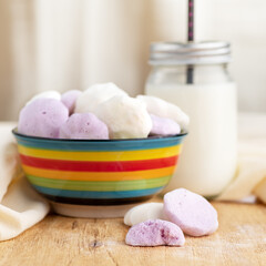 Sweet and airy bizet in a bowl on the table with copy space.