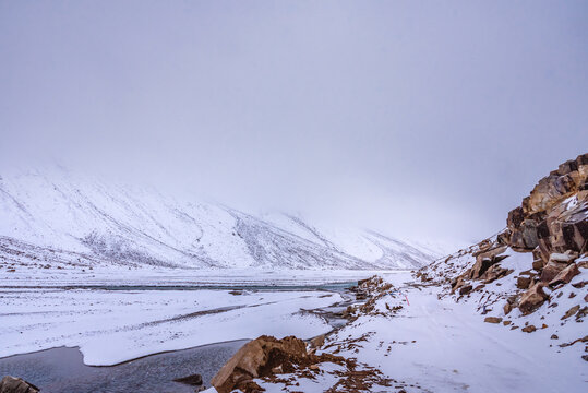 Snow covered beautiful landscape of Chandra river valley in Spiti during winter.  Spiti means 'The Middle Land' is a cold desert mountain valley located high in Himalayas of Himachal Pradesh, India.