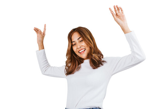 Clipping path image of Asian dyed brown-haired girl in white sweater dancing with hands up and inspired face expression in white background.