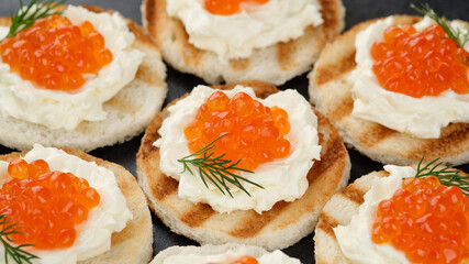 red caviar sandwiches with soft cheese close up