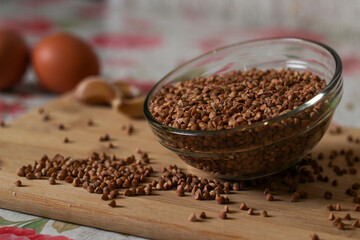 buckwheat in a wooden spoon buckwheat in a wooden bowl buckwheat in a bowl
