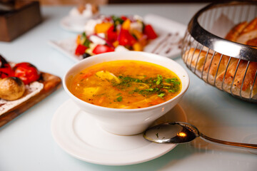 Chicken soup with salad and bread. Russian kitchen.