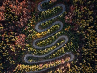 Aerial view of Curved road in the mountains with trucks and cars. Autumn season. Cheia,Brasov,Romania.