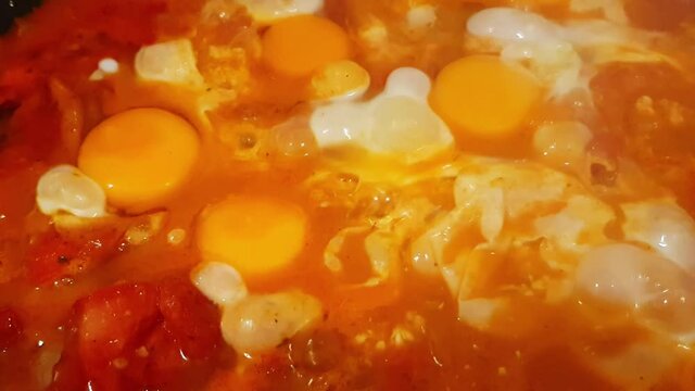 Cooking traditional Hungarian dish called lecs&oacute;
