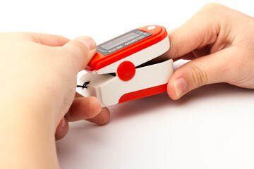 Pulse Oximeter, finger digital device to measure oxygen saturation in blood. Coronavirus symptoms...