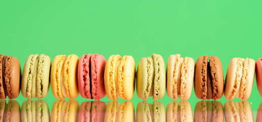 Colorful french macarons on background