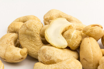 Raw cashew nuts isolated on white background.
