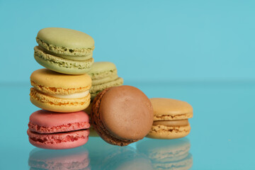 Colorful french macarons on background