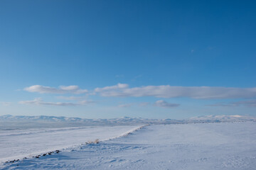 Fototapeta na wymiar snow covered road at winter sunny day