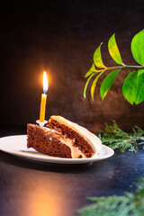 piece of cake candle holiday or birthday homemade baking natural organic ready to eat on the table healthy meal snack ingredient top view copy space for text food background rustic