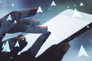 Double exposure of world map with pins hologram and finger clicks on a digital tablet on background. Geolocation tracking and transportation concept