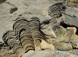 Broken rock with eroded holes of the geological phenomenon of 