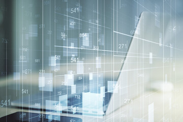 Multi exposure of creative statistics data hologram on laptop background, stats and analytics concept