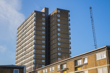 Exterior of a tower block Lulworth at the Agar Grove Estate and a crane in London