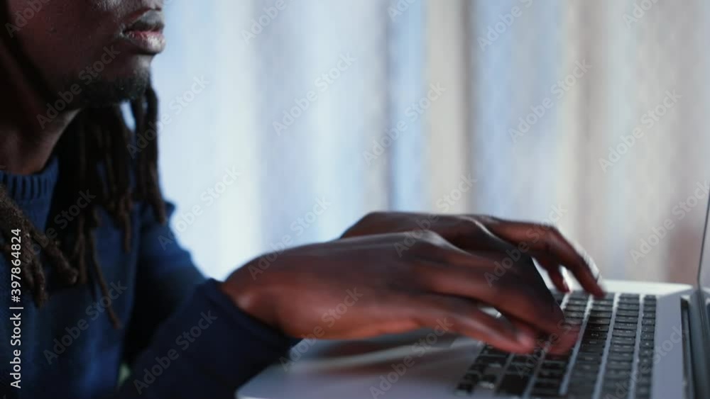 Poster Close-up of black man's hands typing text on the keyboard with fingers. Manager preparing a text document using a computer.