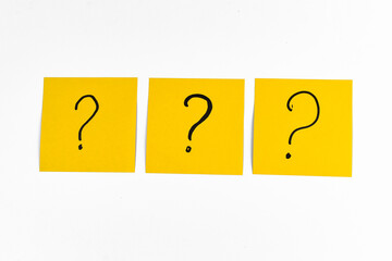 question mark on yellow paper
