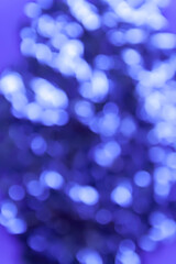 Abstract festive bright colorful background of blurred unfocused lights