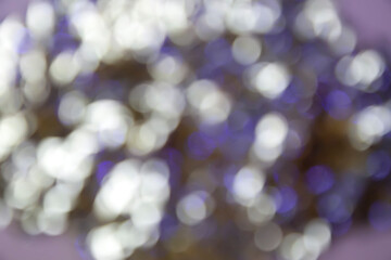 Abstract festive bright colorful background of blurred unfocused lights