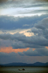 Dusk with orange, gold and purple dramatic sky, seascape and cloudscape