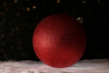 red christmas ball on the snow