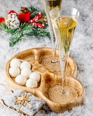 Obraz na płótnie Canvas christmas still life with white chocolate truffles, cookies and sparkling wine