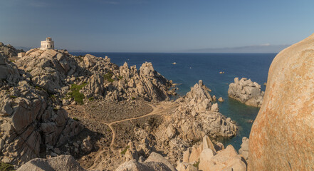 view of the sea from the rocks, rocky coast at noon, norther Sardinia (Italy), granite stones on the water
