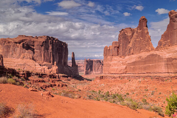 A scenic view on the Park Avenue trail in Arches National park against blue sky, USA