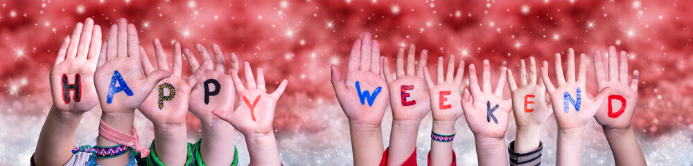 Children Hands Building Colorful English Word Happy Weekend. Red Snowy Christmas Winter Background With Snowflakes And Sparkling Lights