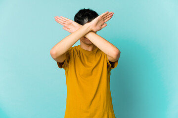Young caucasian skinny man expressing emotions isolated on blue background