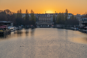Obraz premium Paris, France - 12 28 2019: View of th Basin of the villette and the The Ledoux rotunda at sunset