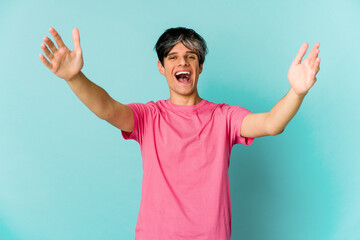 Young caucasian skinny man expressing emotions isolated on blue background