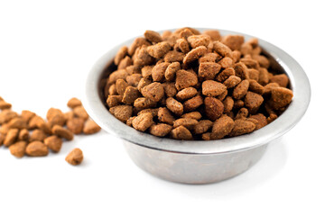 Dog food in a bowl. A full bowl of food on a white background.