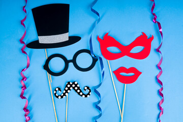 Carnival fun concept - Paper props on a blue background