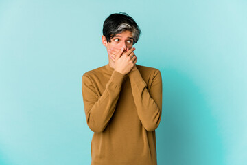 Young caucasian skinny man expressing emotions isolated on blue background