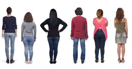 Obraz premium rear view of a woman with jeans on white background