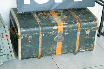 old brown suitcase stands on the floor