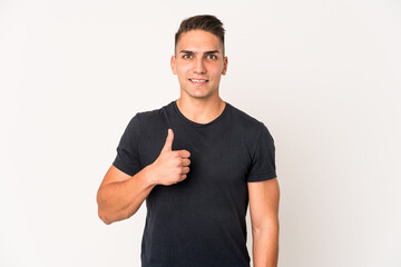 Young caucasian handsome man isolated smiling and raising thumb up