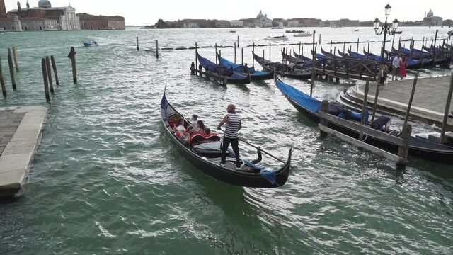 Typical venetian boat sailing in Venice Italy, slow motion
