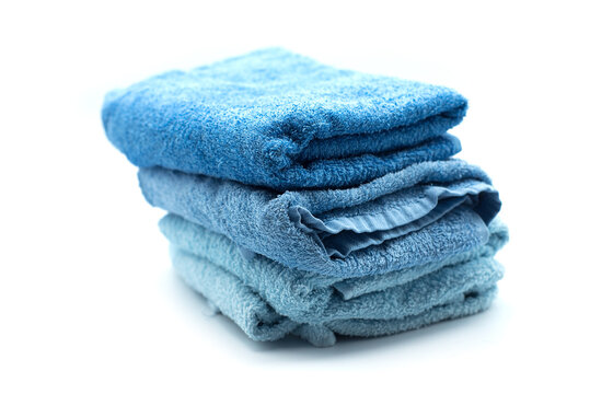 Closep Of Blue Bath Towels Pile On White Background