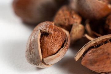 Hazelnuts and cracked nutshells
