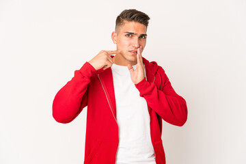 Young caucasian handsome man isolated having a strong teeth pain, molar ache.