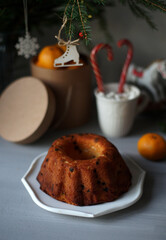 Spruce branch, pastries, toys are on the table.
