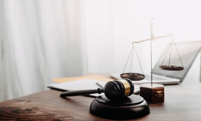 Business and lawyers discussing contract papers with brass scale on desk in office. Law, legal...