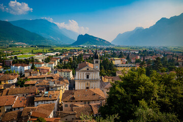 View of the old town of Arco with the Alps and Garda lake in the background