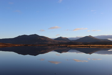 reflection of mountains over lake, south uist, outer hebrides, scotland
