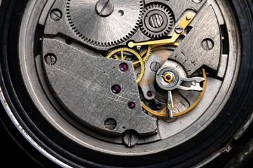 Close-up of gear mechanism of a vintage wrist watch